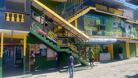Green bar frontage with outdoor staircase